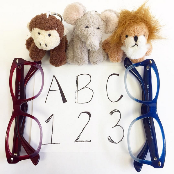 Childrens eyeglasses and stuffed animals