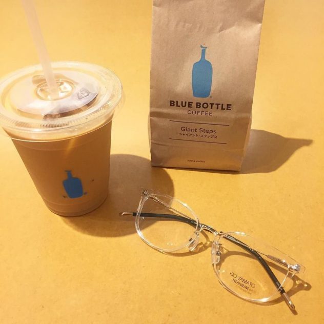 A photo of Kio Yamato eyeglasses and a cup of Blue Bottle Coffee.