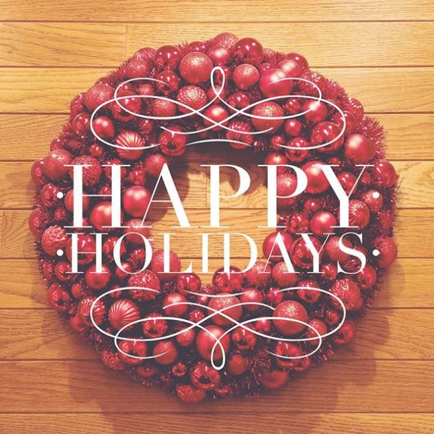 Photo of a Christmas wreath with the words "Happy Holidays" overlayed 