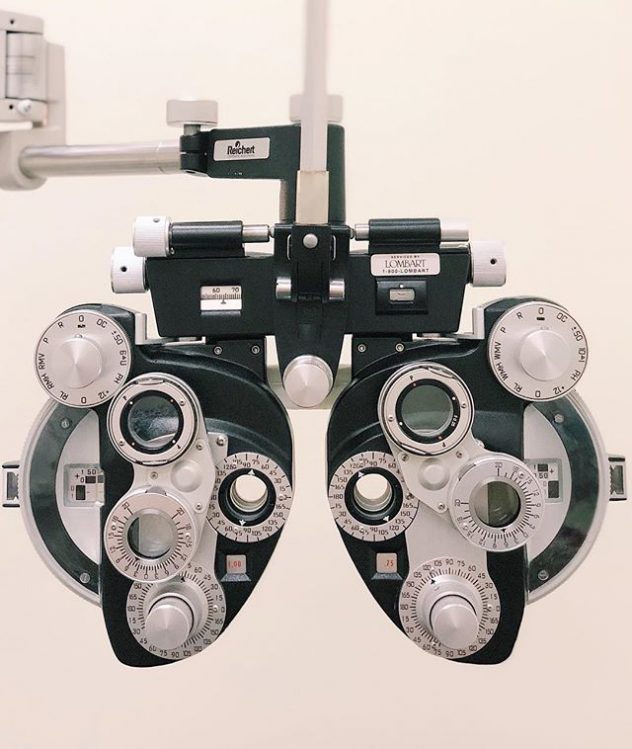 Photograph of eye exam equipment called a phoropter that is used by eye doctors.