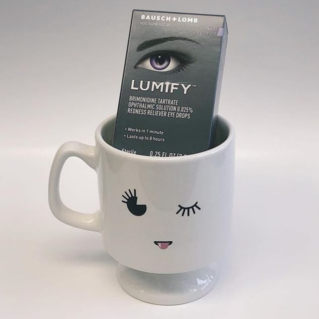 This is a photo of Lumify eyedrops in a coffee cup with winking eyes at the office of eye doctors Daniel Yamamoto & Tracie Inouchi
