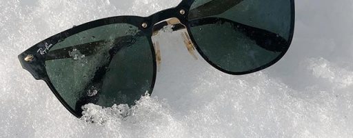 Ray Ban sunglasses on snow.