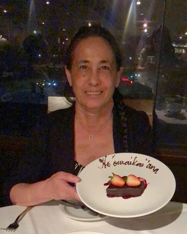 Norma holding her retirement dessert