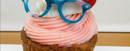 Cupcake with an eyeglass on top of it.